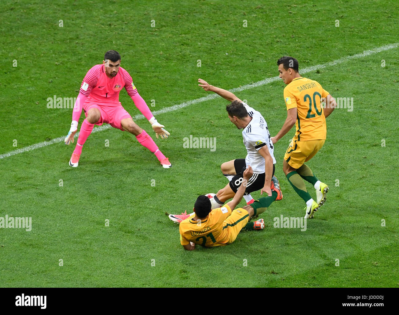 Sochi, Russia. 19th June, 2017. Australia's goalkeeper Maty Ryan (L-R) watches as his teammate Massimo Luongo fouls Germany's Leon Goretzka to concede a penalty during the Confederations Cup group stages Group B match between Australia and Germany in the Fisht Stadium in Sochi, Russia, 19 June 2017. Photo: Marius Becker/dpa/Alamy Live News Stock Photo