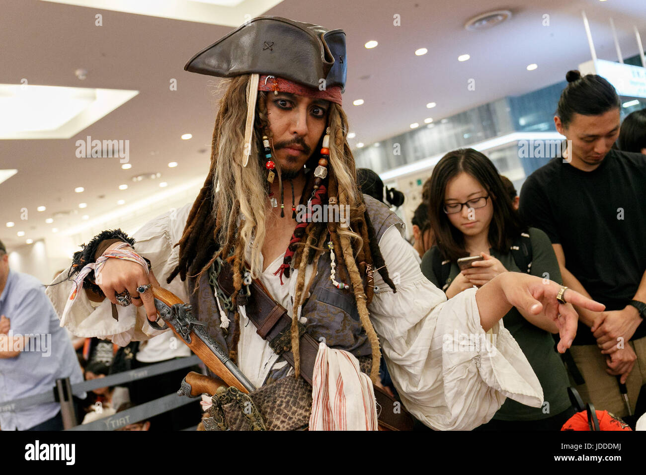 A fan dressed as Captain Jack Sparrow poses for a photograph while waits to greet American actor Johnny Depp at Tokyo International Airport on June 20, 2017, Tokyo, Japan. Hundreds of Japanese fans where waiting at the airport to greet Depp who was happy to shake hands with many of them. Depp came to promote his movie ''Pirates of the Caribbean: Dead Men Tell No Tales'' which will be released in Japan on July 1st. Credit: Rodrigo Reyes Marin/AFLO/Alamy Live News Stock Photo