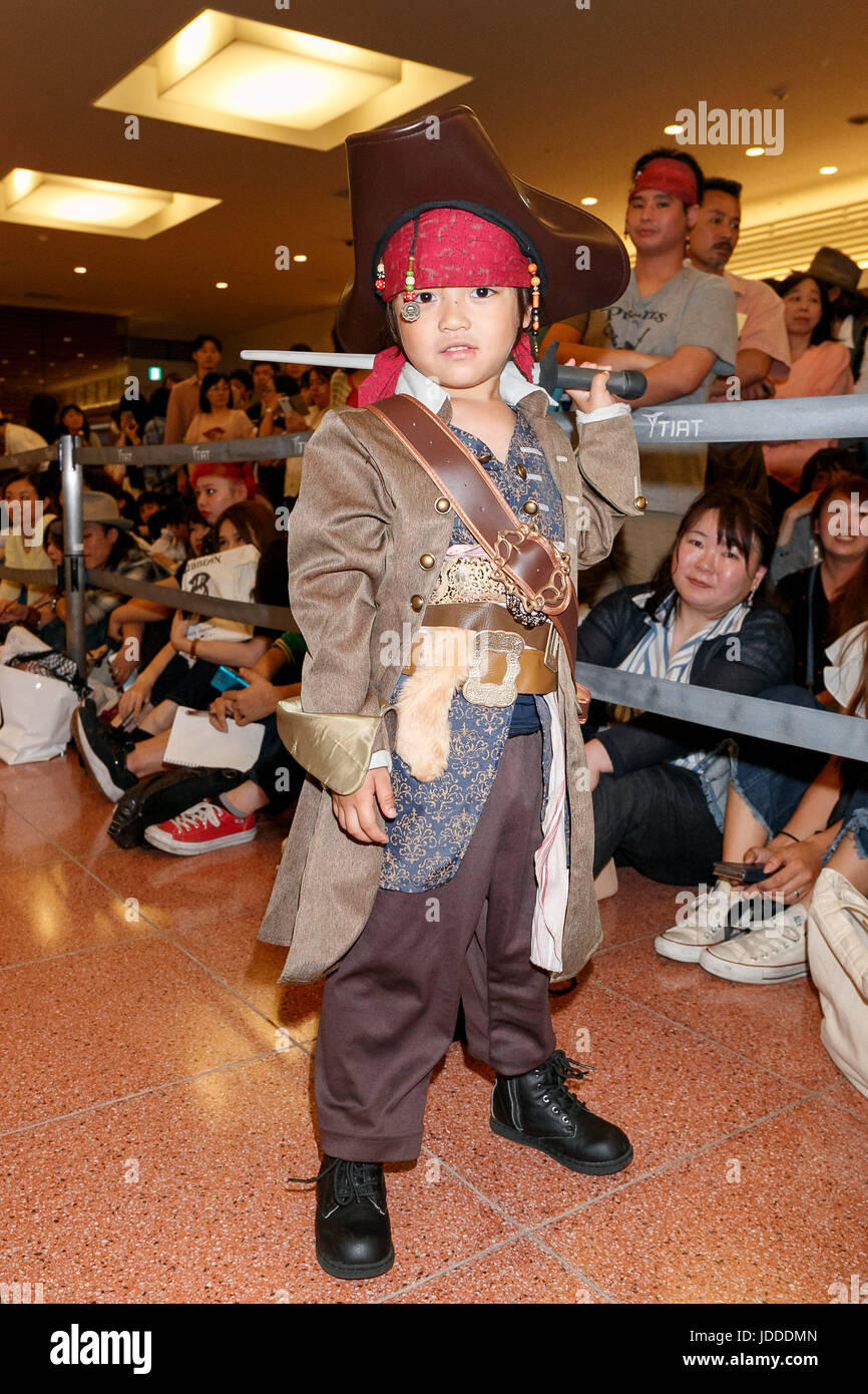 A boy dressed as Captain Jack Sparrow poses for a photograph while waits to greet American actor Johnny Depp at Tokyo International Airport on June 20, 2017, Tokyo, Japan. Hundreds of Japanese fans where waiting at the airport to greet Depp who was happy to shake hands with many of them. Depp came to promote his movie ''Pirates of the Caribbean: Dead Men Tell No Tales'' which will be released in Japan on July 1st. Credit: Rodrigo Reyes Marin/AFLO/Alamy Live News Stock Photo