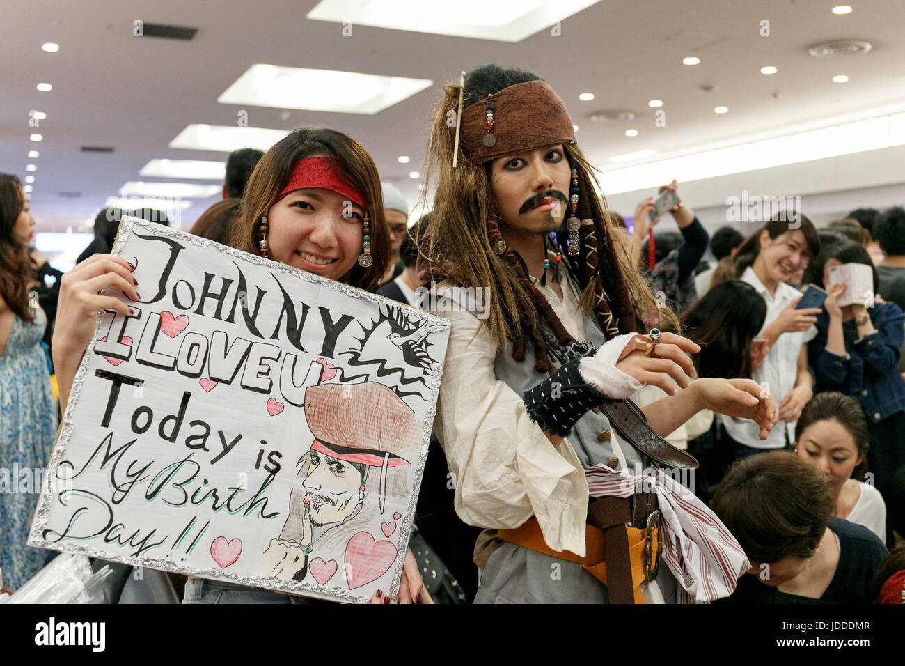 A fan dressed as Captain Jack Sparrow (R) poses for a photograph while waits to greet American actor Johnny Depp at Tokyo International Airport on June 20, 2017, Tokyo, Japan. Hundreds of Japanese fans where waiting at the airport to greet Depp who was happy to shake hands with many of them. Depp came to promote his movie ''Pirates of the Caribbean: Dead Men Tell No Tales'' which will be released in Japan on July 1st. Credit: Rodrigo Reyes Marin/AFLO/Alamy Live News Stock Photo