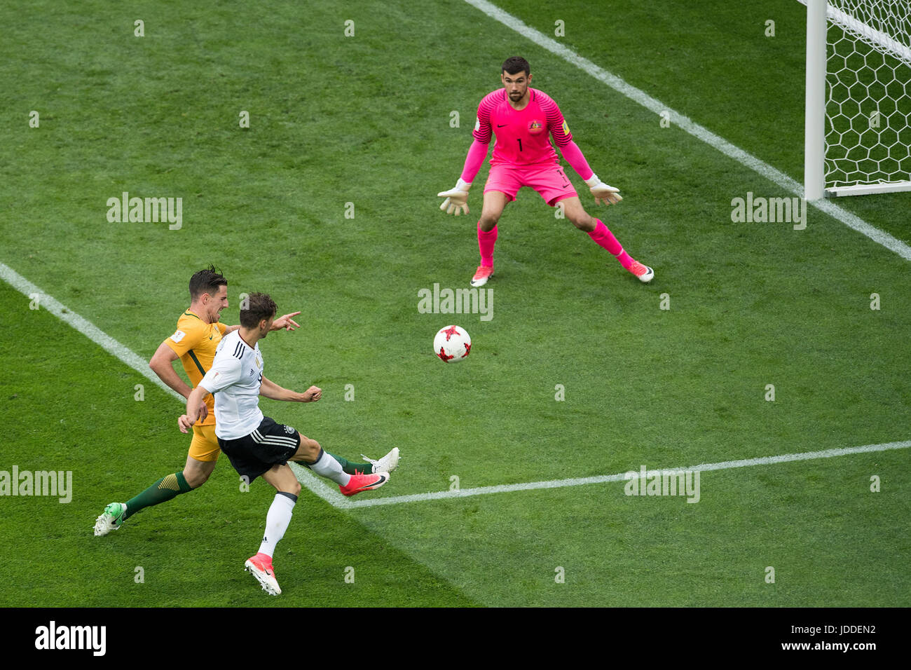 Sochi, Russia. 19th June, 2017. Germany's Leon Goretzka (in white) beats Australian keeper Maty Ryan (in pink) and defender Milos Degenek (C) to give his side a 3:1 lead during the Confederations Cup group stages Group B match between Australia and Germany in the Fisht Stadium in Sochi, Russia, 19 June 2017. Germany won 3:2. Photo: Marius Becker/dpa/Alamy Live News Stock Photo