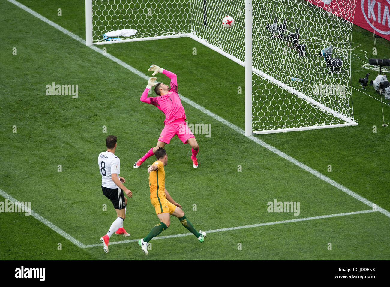 Sochi, Russia. 19th June, 2017. Germany's Leon Goretzka (in white) beats Australian keeper Maty Ryan (in pink) and defender Milos Degenek (C) to give his side a 3:1 lead during the Confederations Cup group stages Group B match between Australia and Germany in the Fisht Stadium in Sochi, Russia, 19 June 2017. Germany won 3:2. Photo: Marius Becker/dpa/Alamy Live News Stock Photo