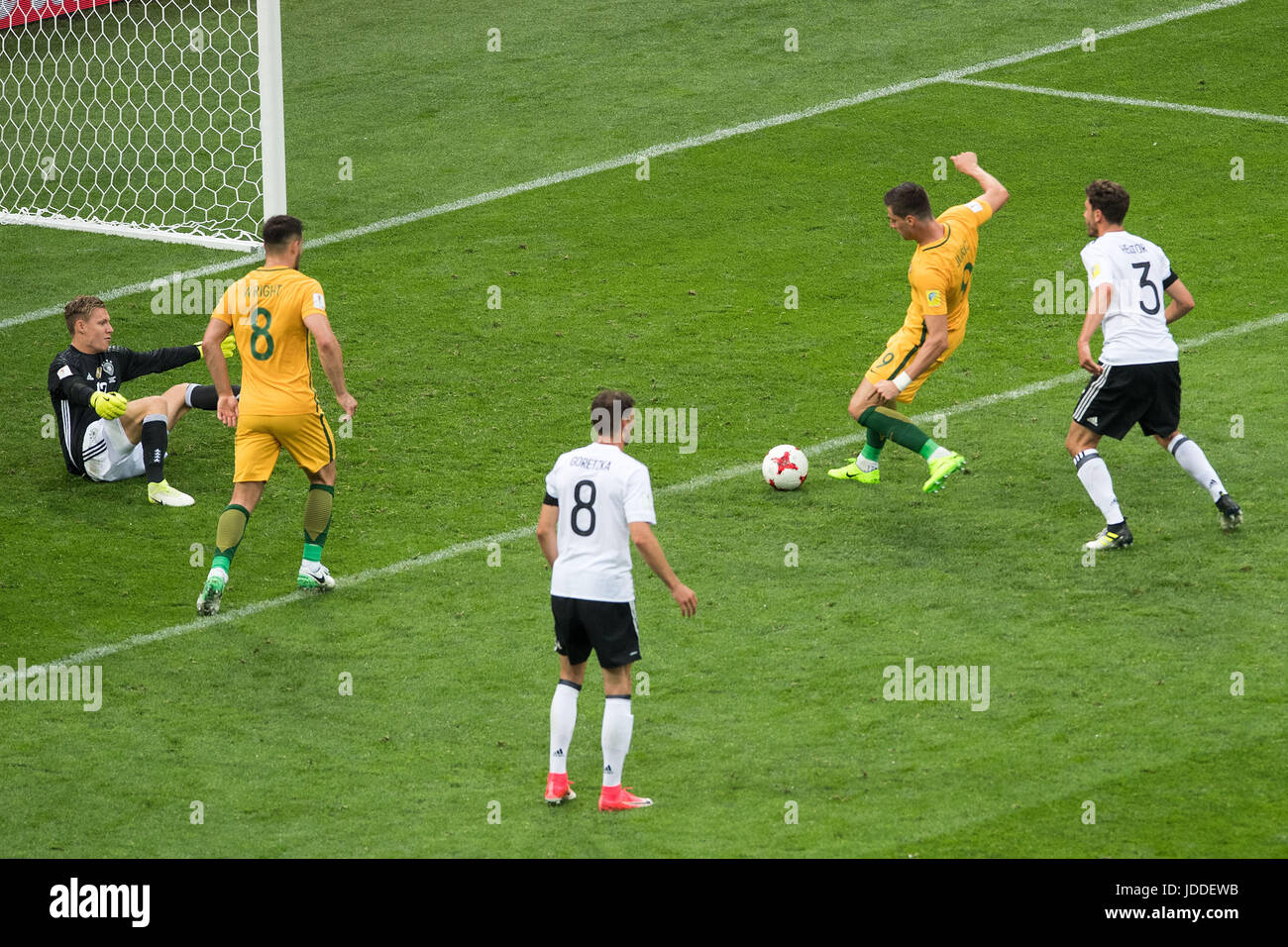 Sochi, Russia. 19th June, 2017. Australia's Tomi Juric (2-R) puts the ball past Germany's goalkeeper Bernd Leno (L) as Australia's Bailey Wright (L-R), Germany's Leon Goretzka and Jonas Hector look on to leave the score at 3:2 in Germany's favour during the Confederations Cup group stages Group B match between Australia and Germany in the Fisht Stadium in Sochi, Russia, 19 June 2017. Germany won 3:2. Photo: Marius Becker/dpa/Alamy Live News Stock Photo
