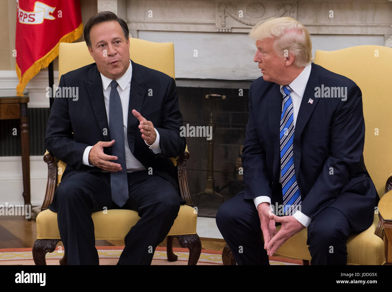 Washington DC, USA. 19th June, 2017. United States President Donald J. Trump meets with President Juan Carlos Varela of Panama in the Oval Office of the White House in Washington, DC on June 19, 2017. First lady Melania Trump is at right. Credit: Molly Riley/Pool via CNP /MediaPunch/Alamy Live News Stock Photo
