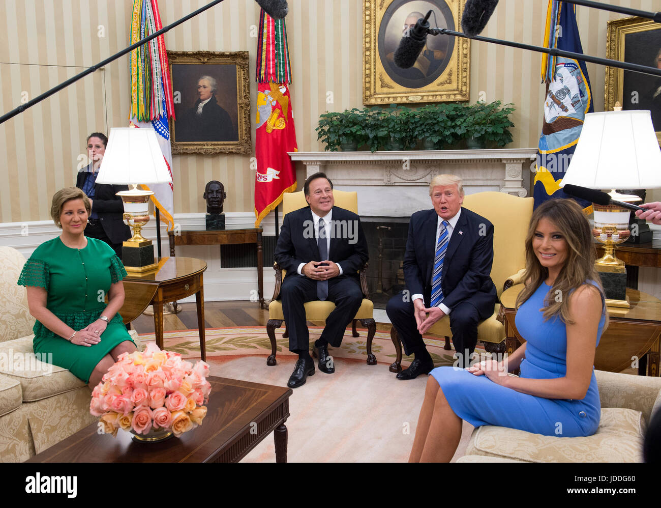 Washington DC, USA. 19th June, 2017. United States President Donald J. Trump meets with President Juan Carlos Varela of Panama in the Oval Office of the White House in Washington, DC on June 19, 2017. Also seated are Lorena Castillo, left, and first lady Melanie Trump, right. Credit: Molly Riley/CNP /MediaPunch/Alamy Live News Stock Photo