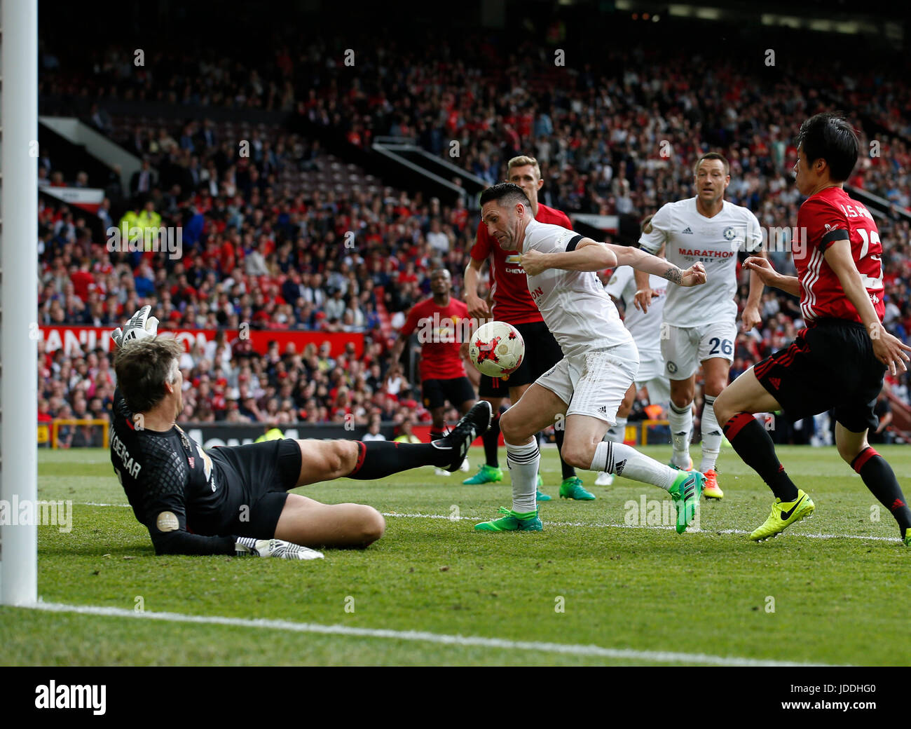 Manchester, UK. 4th June, 2017. Edwin Van Der Saar blocks Robbie Keane during the Michael Carrick Testimonial match at the Old Trafford Stadium, Manchester. Picture date: June 4th 2017. Picture credit should read: Simon Bellis/Sportimage/CSM/Alamy Live News Stock Photo