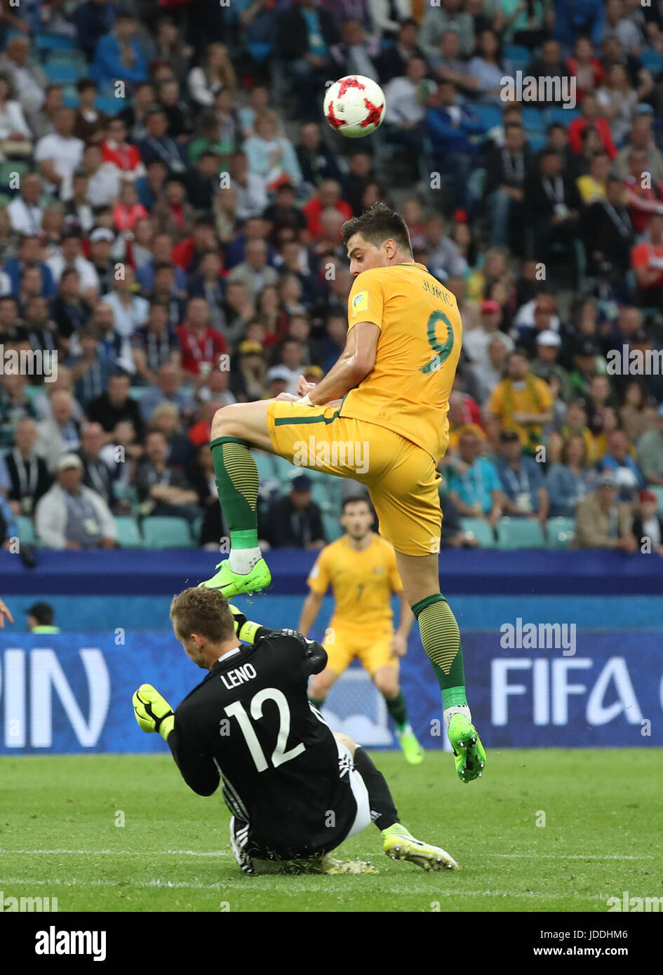 Sochi, Russia. 19th June, 2017. Goalkeeper Kevin Trapp (bottom) of Germany vies with Tomi Juric of Australia during during the group B match between Australia and Germany of the 2017 FIFA Confederations Cup in Sochi, Russia, on June 19, 2017. Germany won 3-2. Credit: Xu Zijian/Xinhua/Alamy Live News Stock Photo