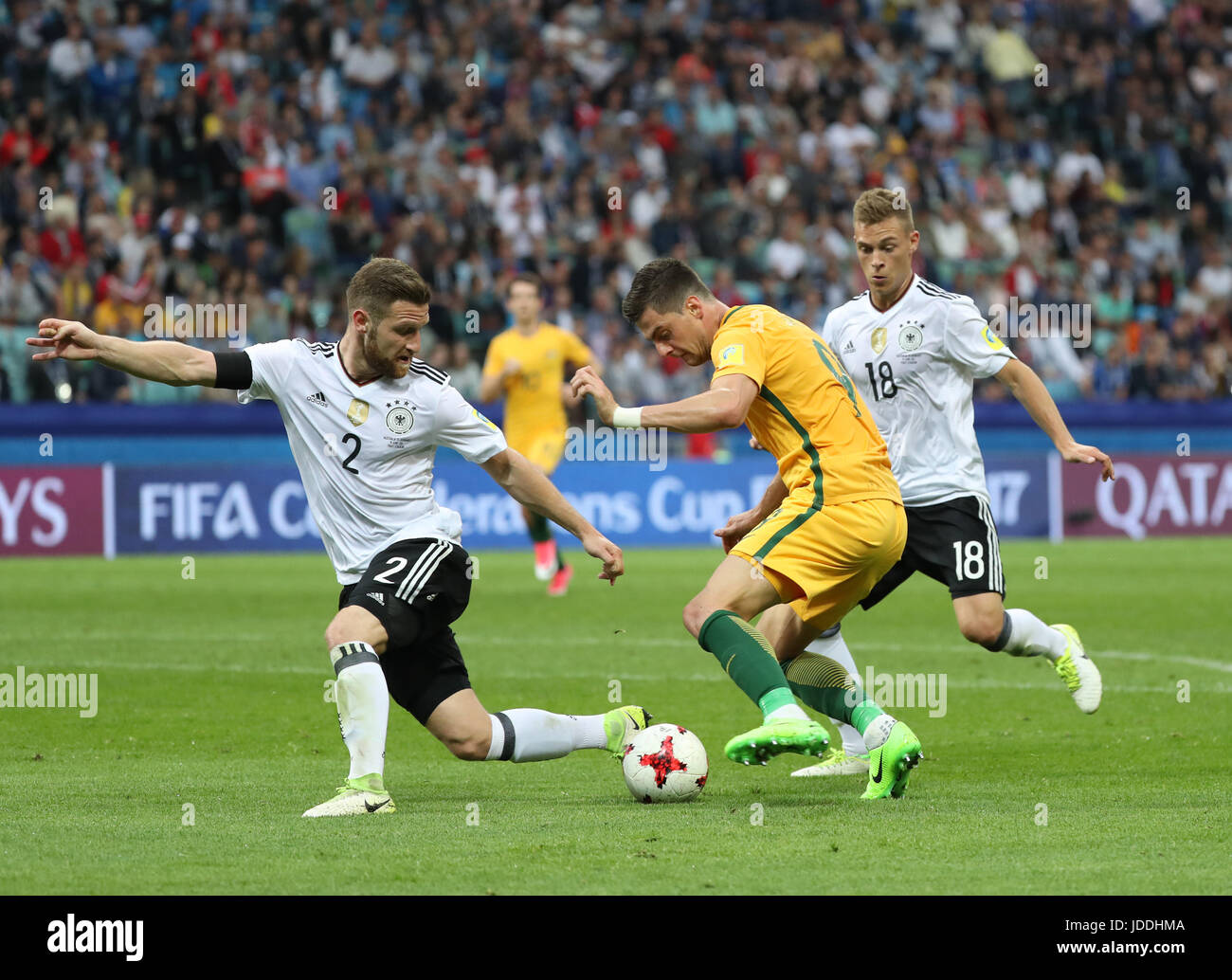 Sochi, Russia. 19th June, 2017. Shkodran Mustafi (L) of Germany vies with Tomi Juric (C) of Australia during during the group B match between Australia and Germany of the 2017 FIFA Confederations Cup in Sochi, Russia, on June 19, 2017. Germany won 3-2. Credit: Xu Zijian/Xinhua/Alamy Live News Stock Photo