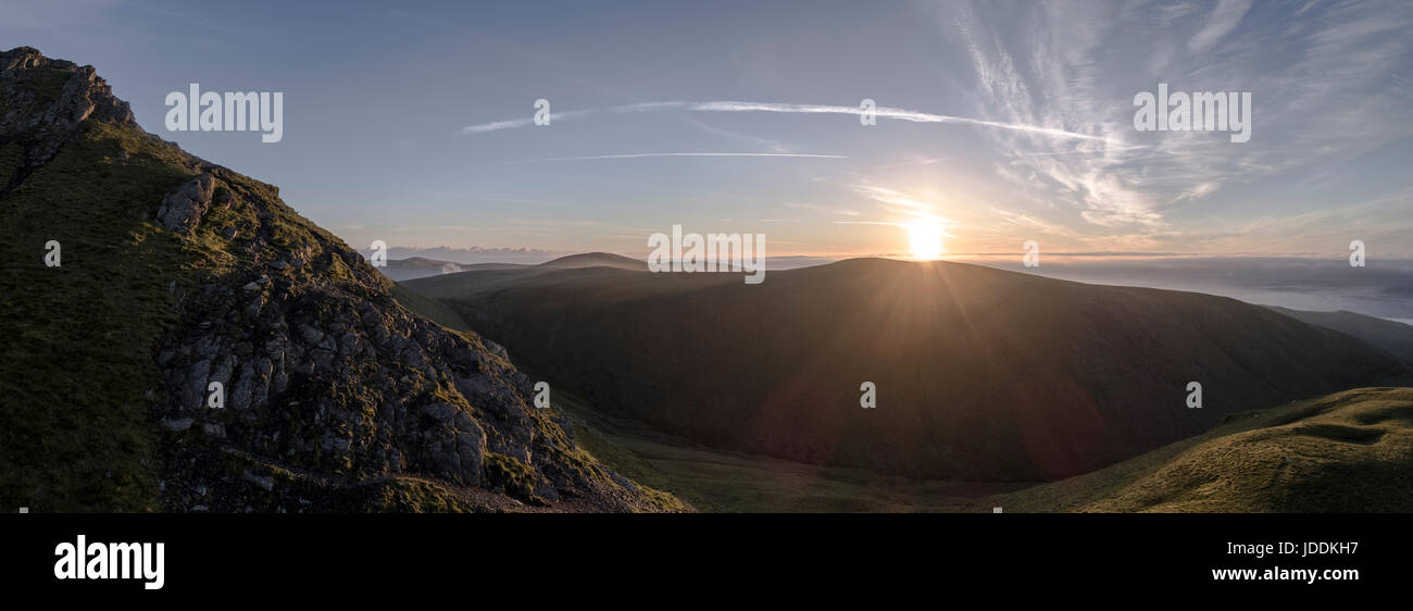 Sharp Edge, Blencathra, Cumbria Lake District, UK. 20th June, 2017. Sunrise over Sharp Edge, Blencathra, Cumbria Lake District Credit: Russell Millner/Alamy Live News Stock Photo