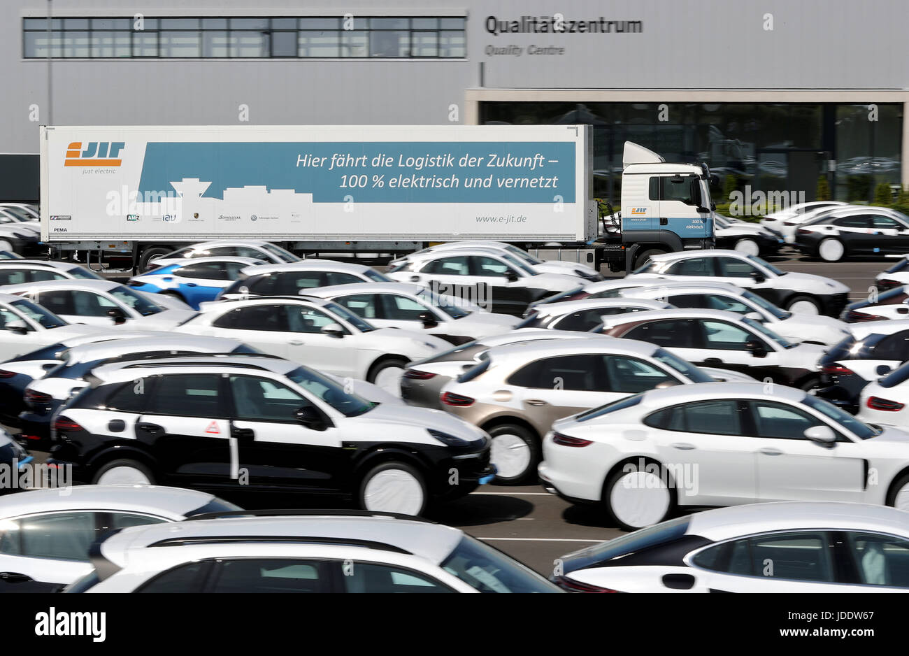 - ATTENTION EDITORS -PUBLICATION EMBARGO TUESDAY 20.06.2017 -20.30 - A fully electric, 40-ton trailer drives through the factory premises of Porsche in Leipzig, Germany, 15 June 2017. The research project eJIT developed, in cooperation with other companies, this first competitive electric trailer. Volkswagen's Zwickau Factory and Porsche Leipzig GmbG will be the first auto manufacturers in Europe to deploy the electric trailer in actual logistics operations. The two electric trailers reach speeds of up to 85 km/h with their 280 kilowatts of continuous power and 320 kilowatts of peak power as w Stock Photo