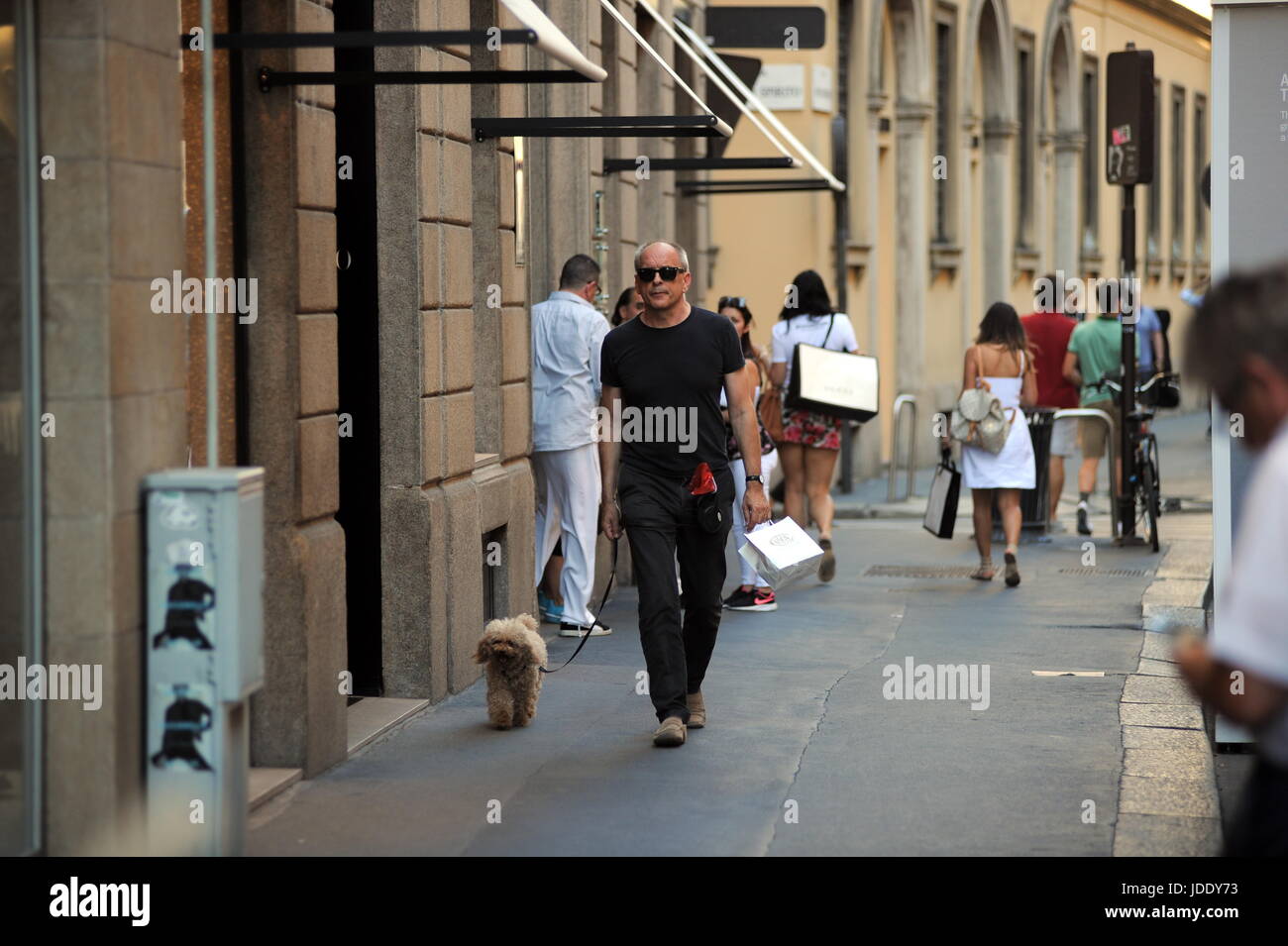 Milan, Tomas Arana Walking His Dog The famous American actor TOMAS ARANA, engaged with Silvia Damiani, owner, together with the brothers Guido and Giorgio of the famous brand of 'DAMIANI' jewels, walks alone in the center. Here, in Montenapoleone on a very hot afternoon, with a pair of black glasses for not knowing if you bring your dog for a short walk. Stock Photo