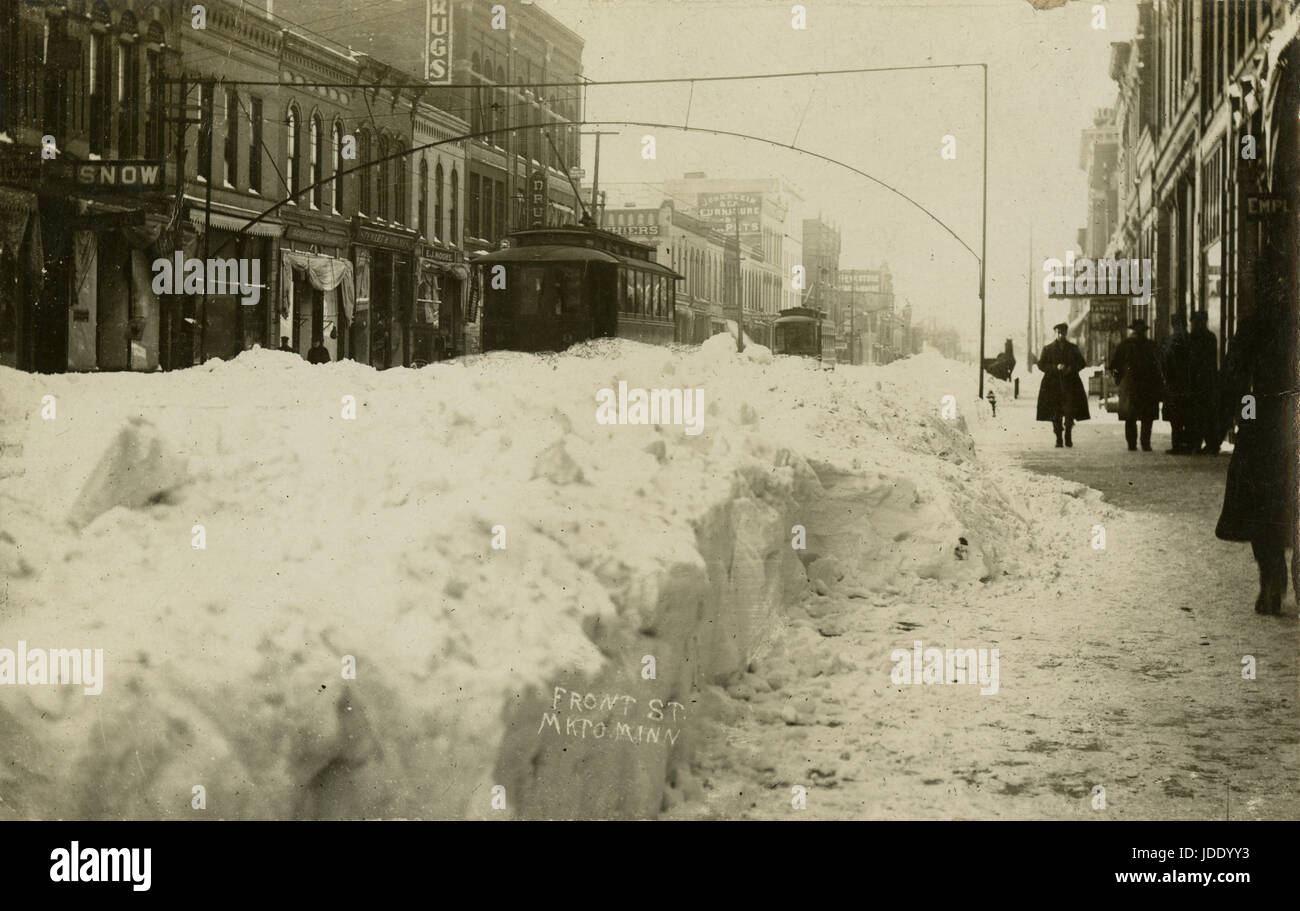 Antique February 10, 1909 photograph, winter on Front Street in Mankato, Minnesota. SOURCE: ORIGINAL REAL PHOTO POSTCARD. Stock Photo