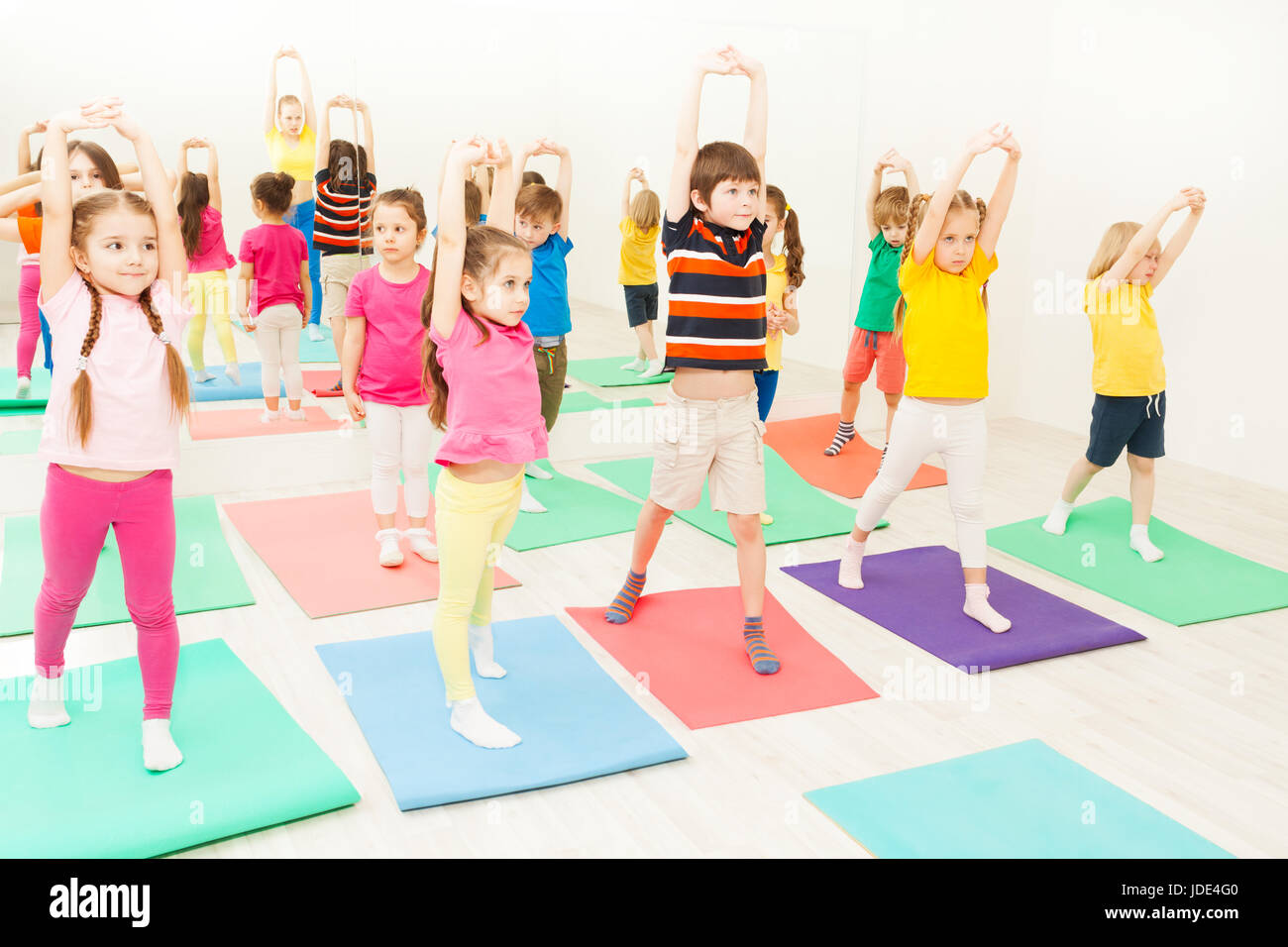 Big group of 5 6 years old kids stretching and exercising during gymnastic lesson in gym Stock Photo Alamy
