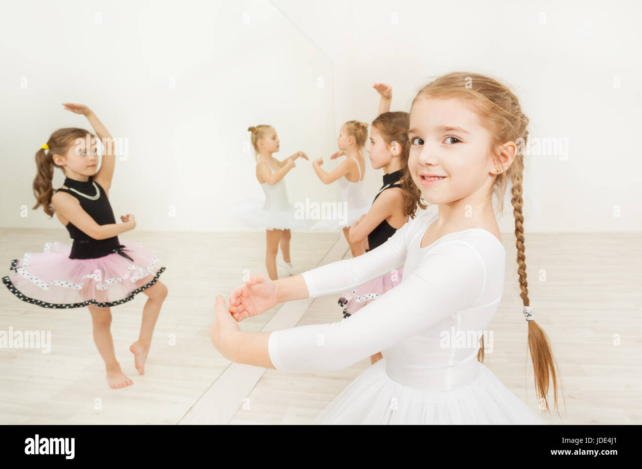 Portrait of adorable ballerina, six years old girl, standing in first  position during ballet class Stock Photo - Alamy