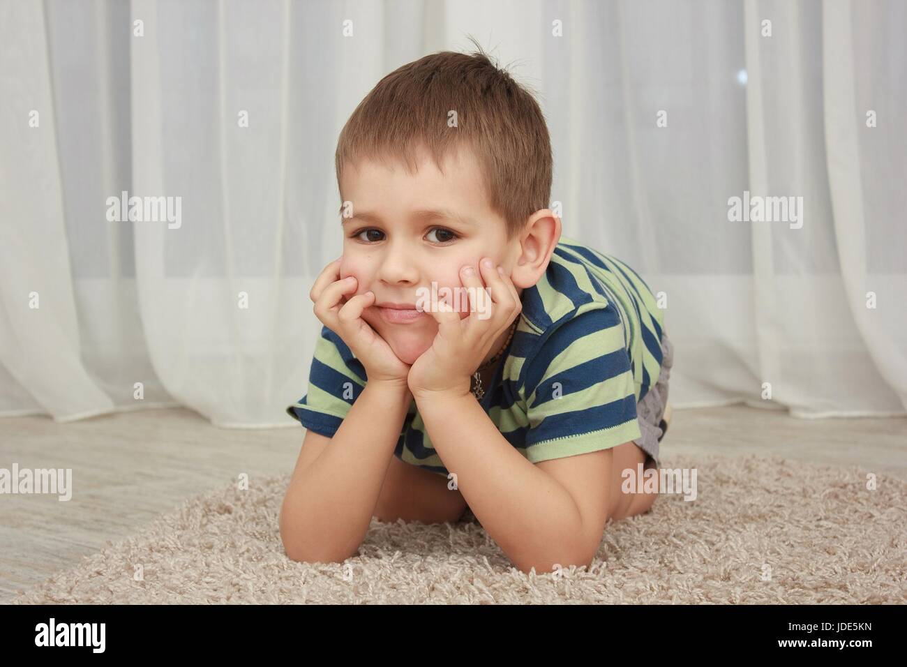 Portrait of cute little boy at home Stock Photo - Alamy