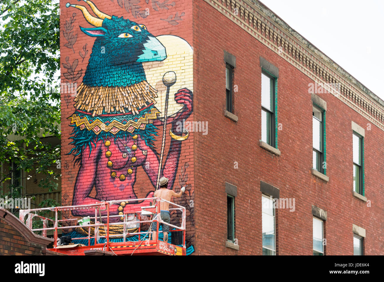 Montreal, 17 June 2017 Artist Sbu One is painting a Mural during