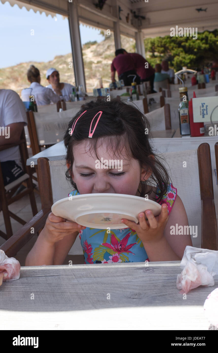 Licking food plate hires stock photography and images Alamy