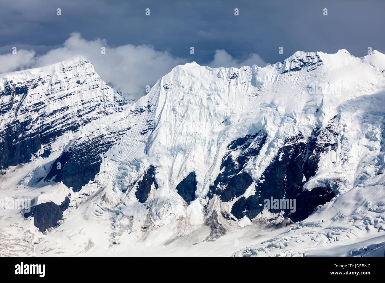Aerial View of jagged snow capped mountain and glaciers in Alaska Stock ...