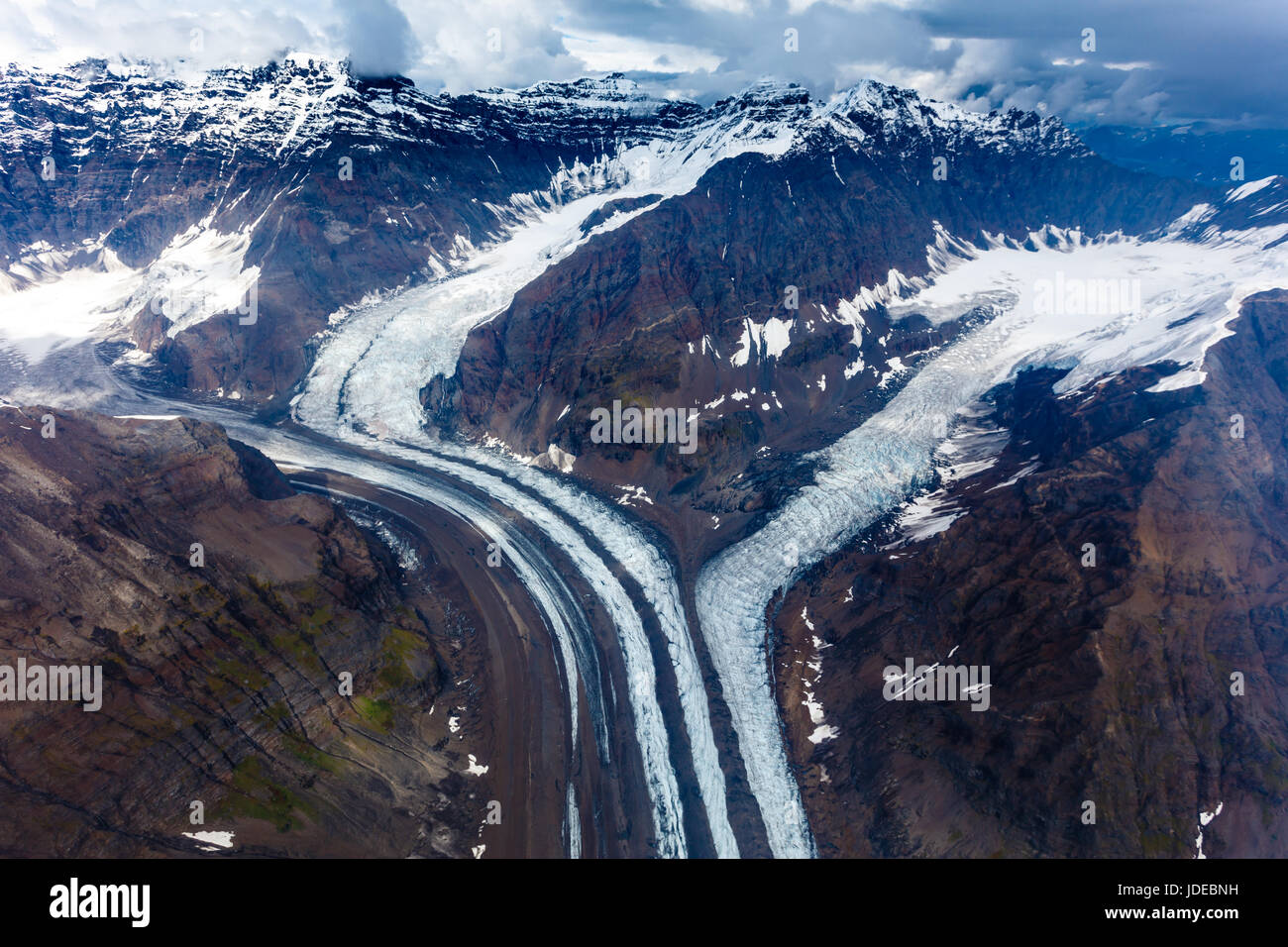 Pattern of snow capped mountains and melting glaciers in Alaska wilderness Stock Photo