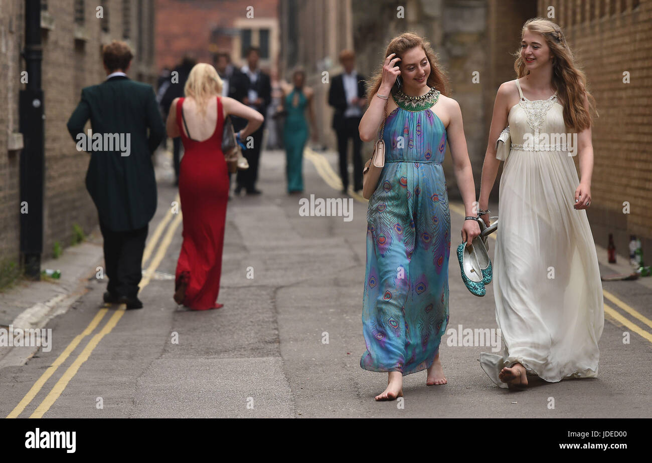 Students from Trinity, Clare and and Jesus College's at Cambridge University make their way home after celebrating the end of the academic year at the May Ball. Stock Photo