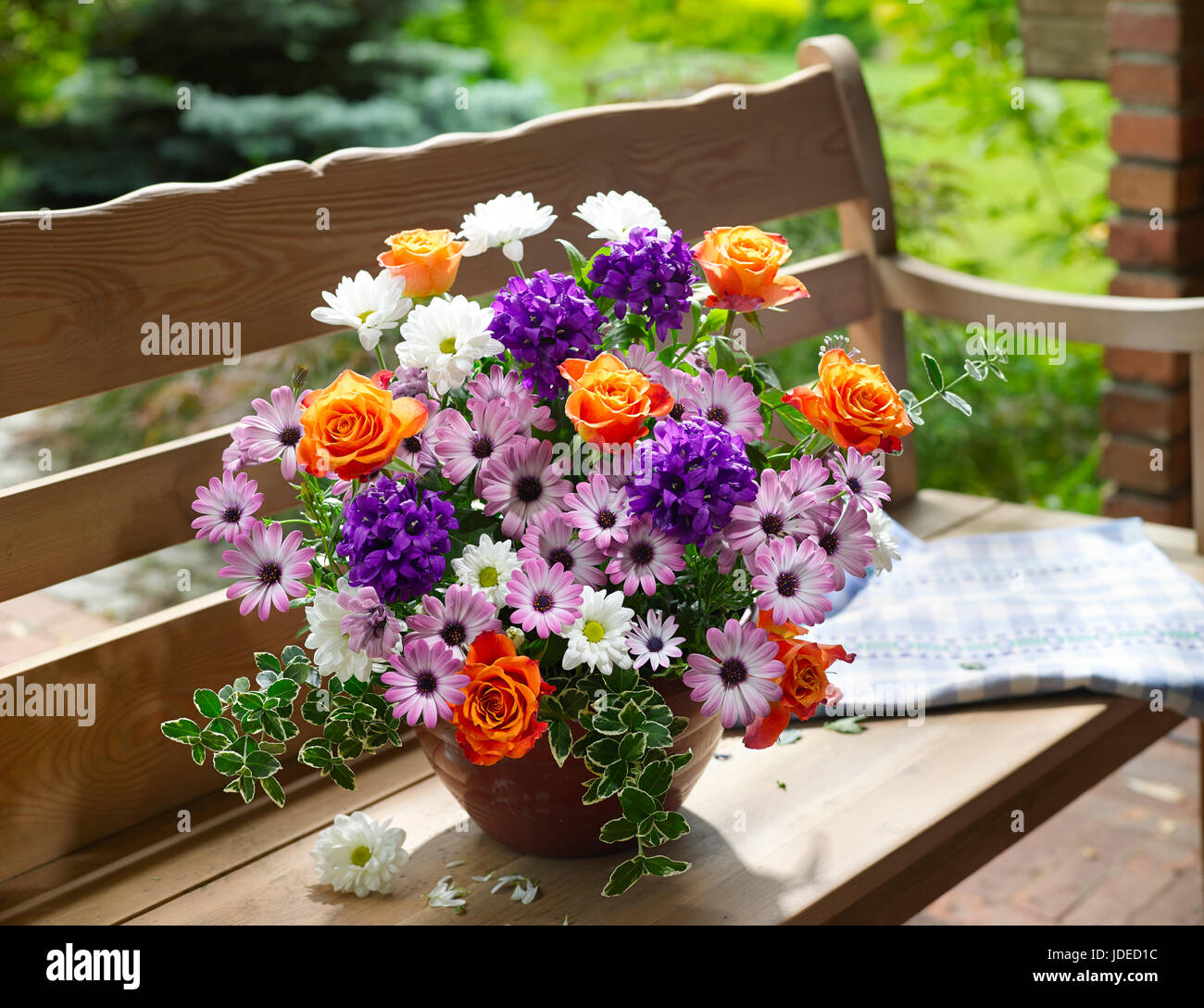 Bouquet of flowers with daisies and roses. Stock Photo