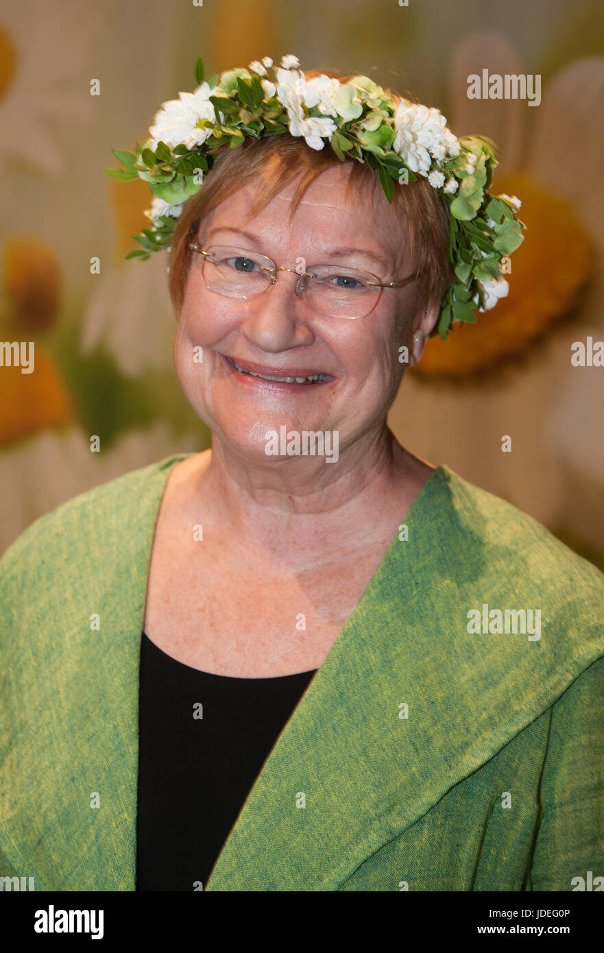 TARJA HALONEN former Finish president with flower ring on the head 2017 Stock Photo