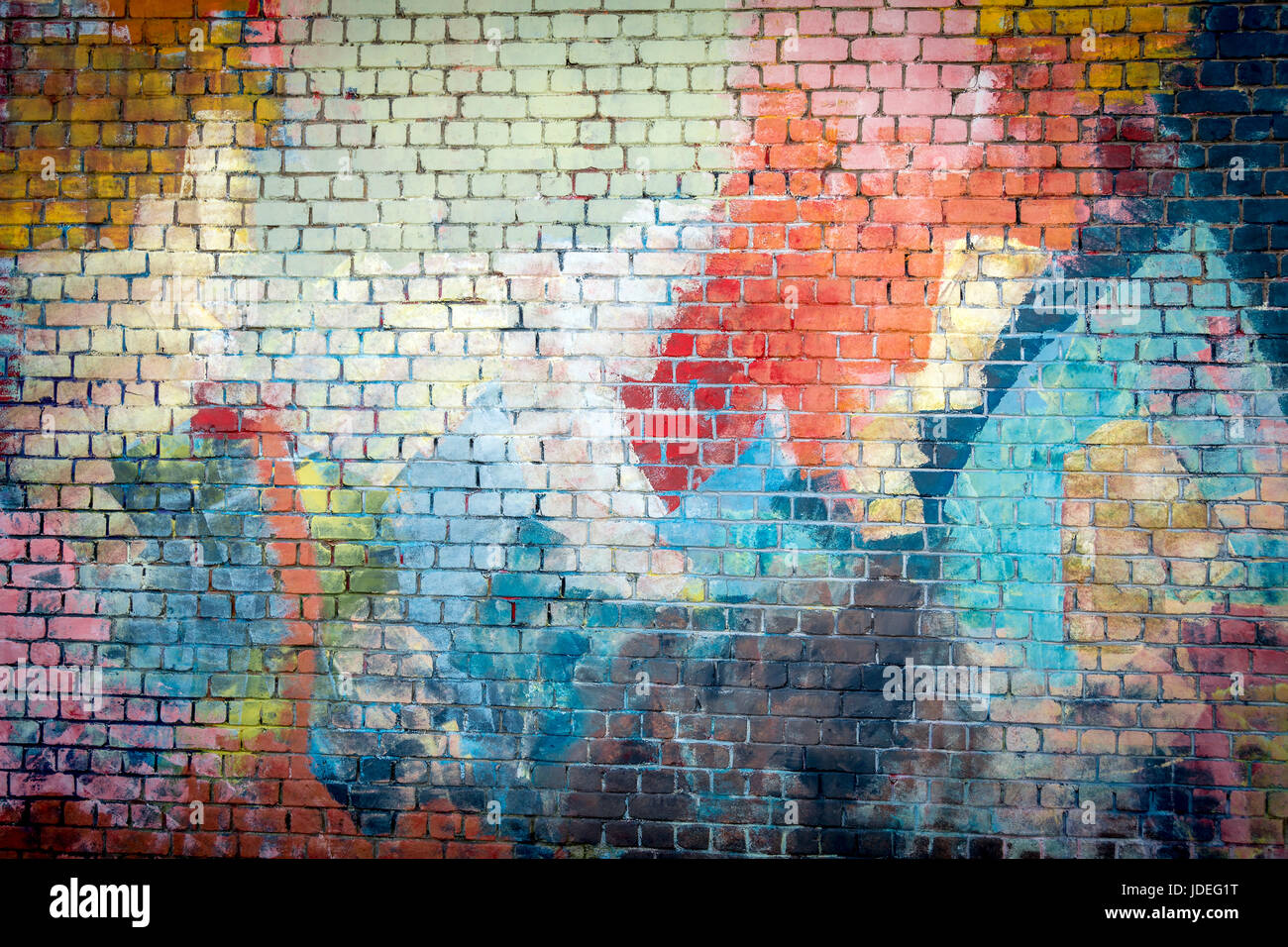 Multi coloured graffiti painted brick wall background Stock Photo - Alamy