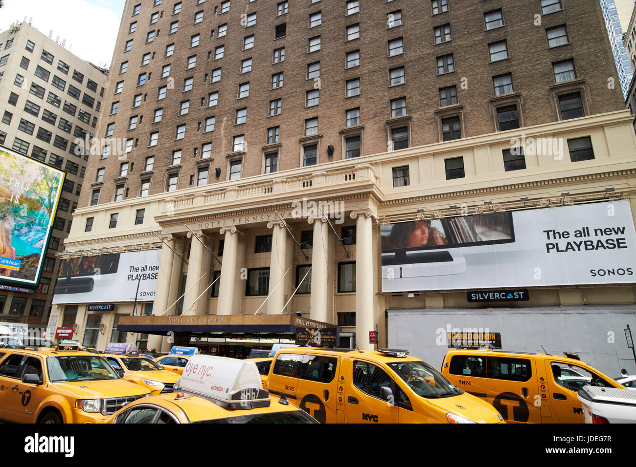 yellow cabs on 7th avenue outside Hotel Pennsylvania New York City USA Stock Photo
