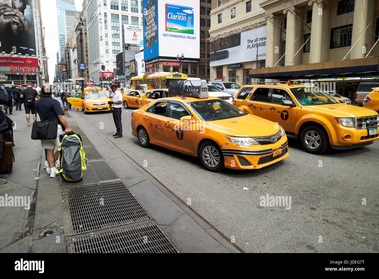 yellow cabs stop at taxi rank on 7th avenue New York City USA Stock Photo