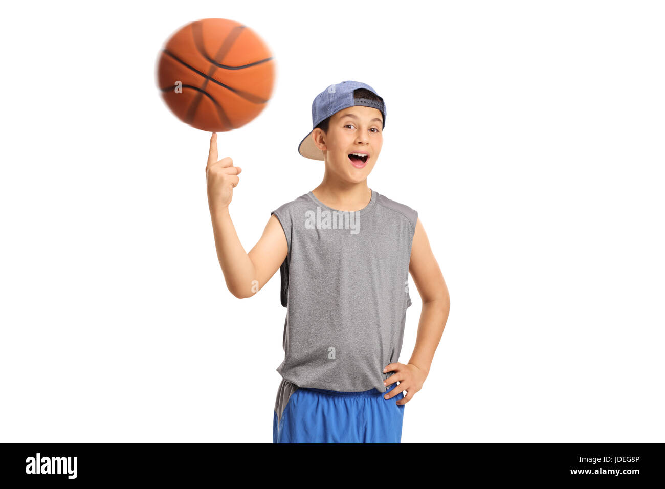 Joyful boy spinning a basketball on his finger isolated on white background  Stock Photo - Alamy