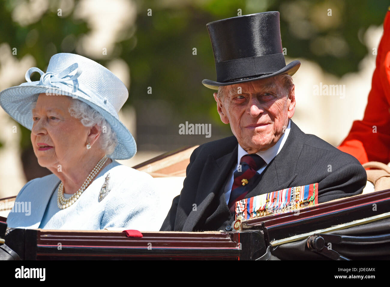 The Queen and Prince Philip in a carriage during Trooping the Colour 2017, The Mall, London. Duke of Edinburgh looking old, wearing black suit, medals Stock Photo
