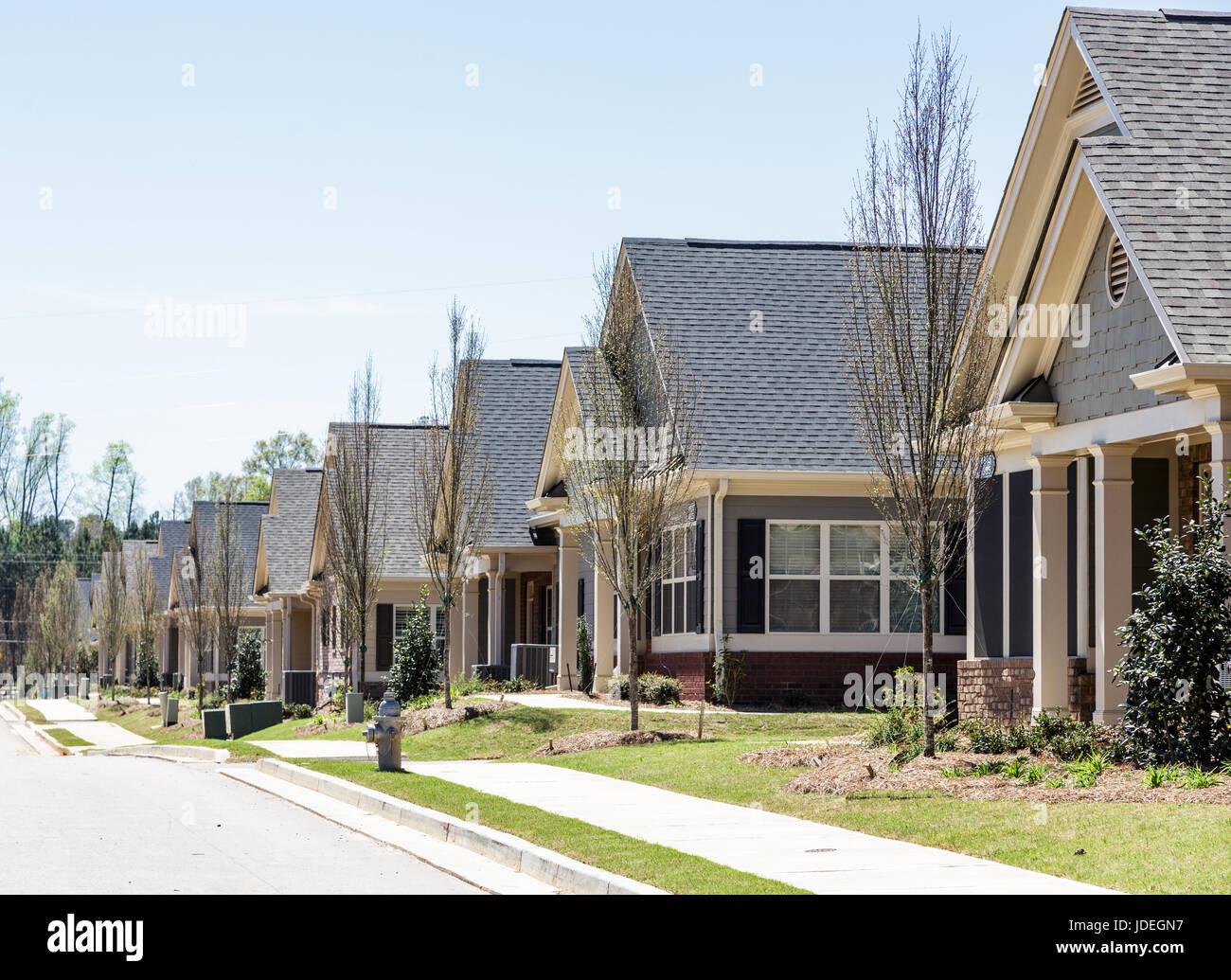 A row of modern townhouses in a new subdivision Stock Photo - Alamy