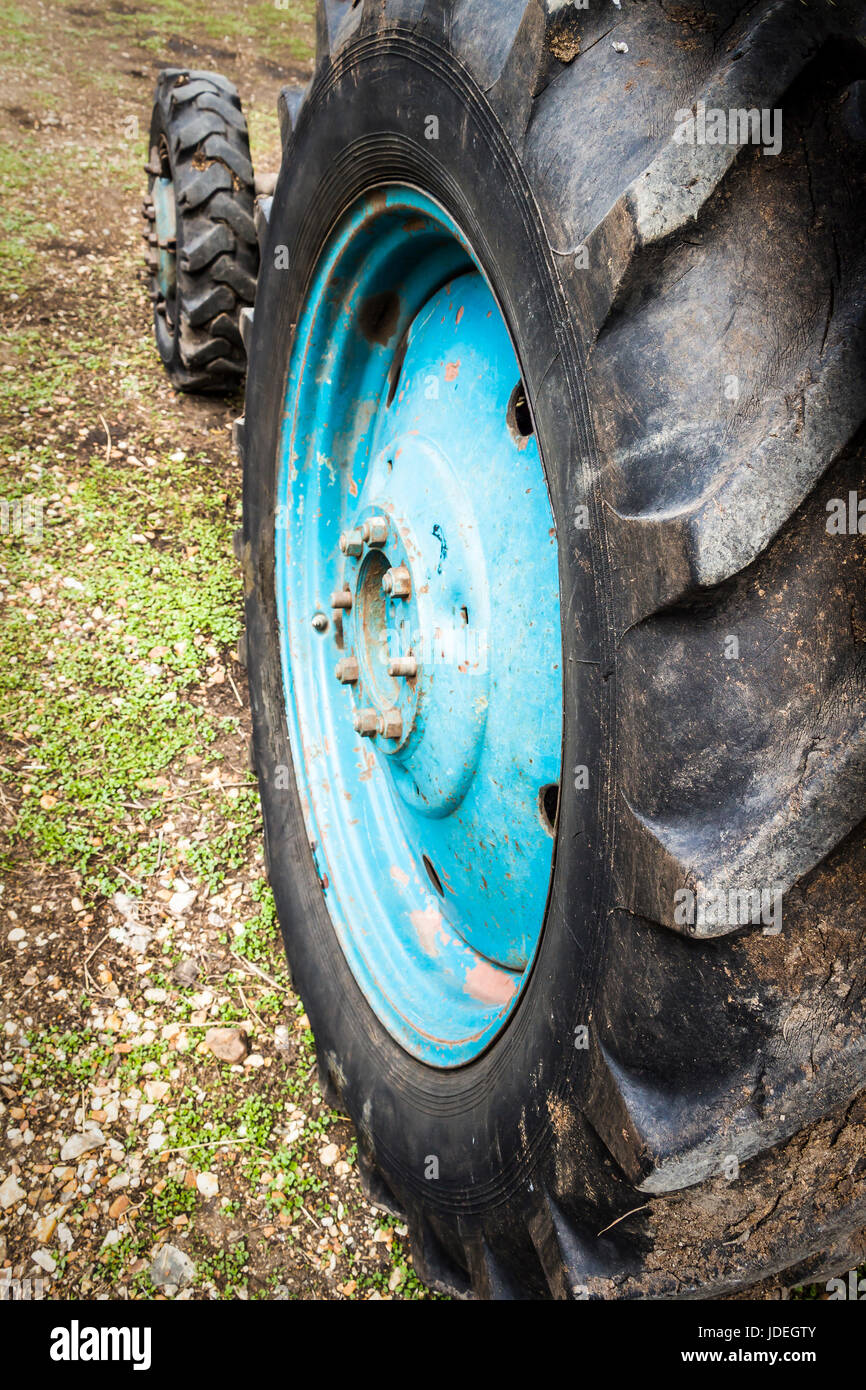 Wheels agricultural tractor standing in the backyard Stock Photo - Alamy