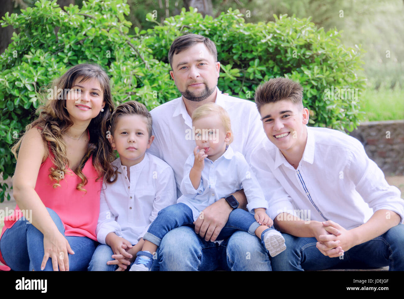 Portrait of a happy family in the park. Family concepts Stock Photo - Alamy