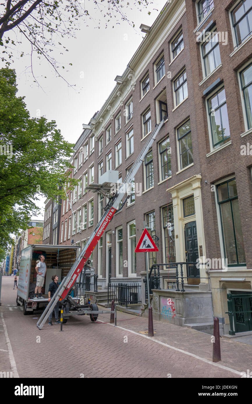 moving house, canal house, crane, lift Stock Photo Alamy