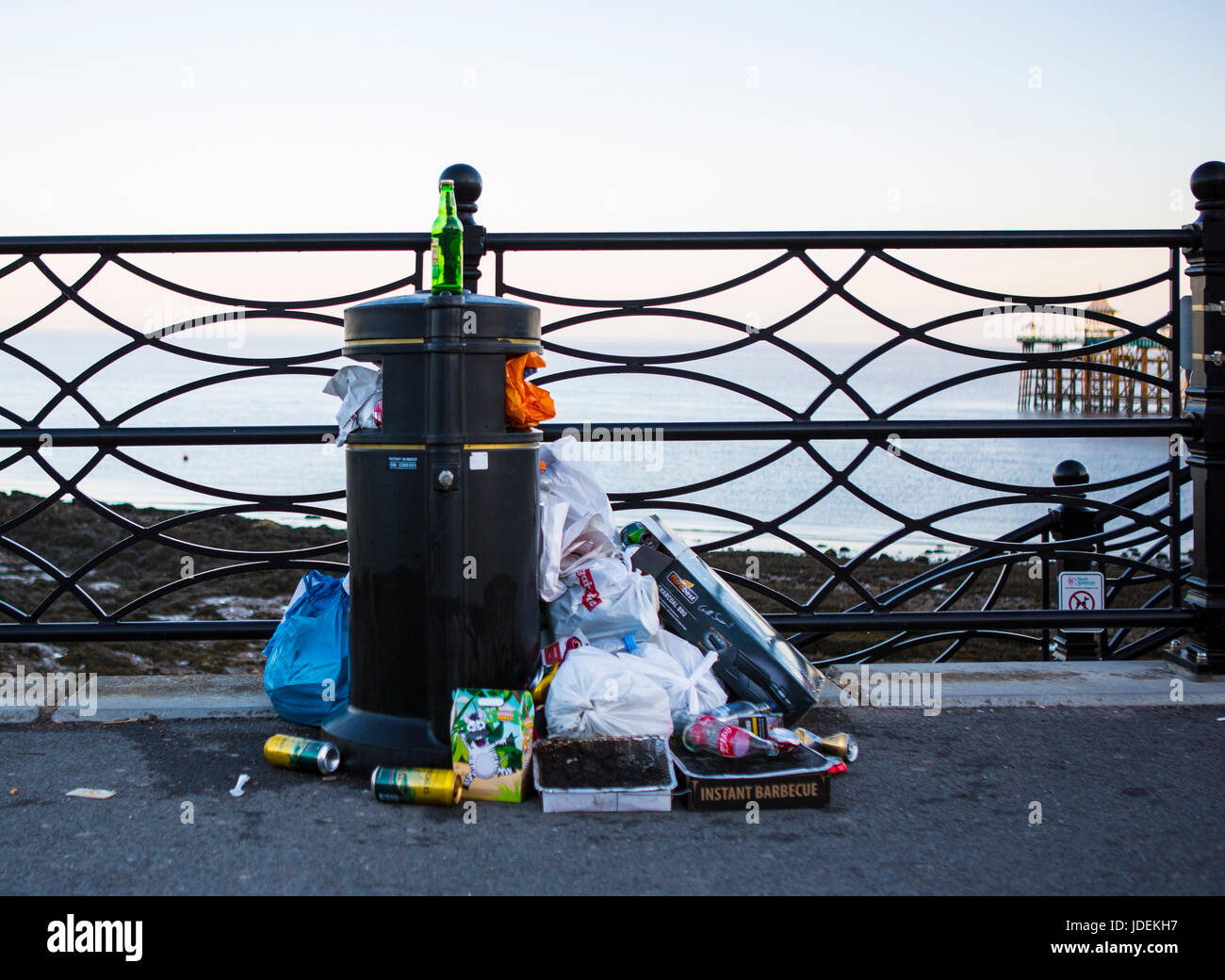 CLEVEDON, UK - JUNE 18, 2017: Overflowing rubish bin on Clevedon sea front in somerset Stock Photo