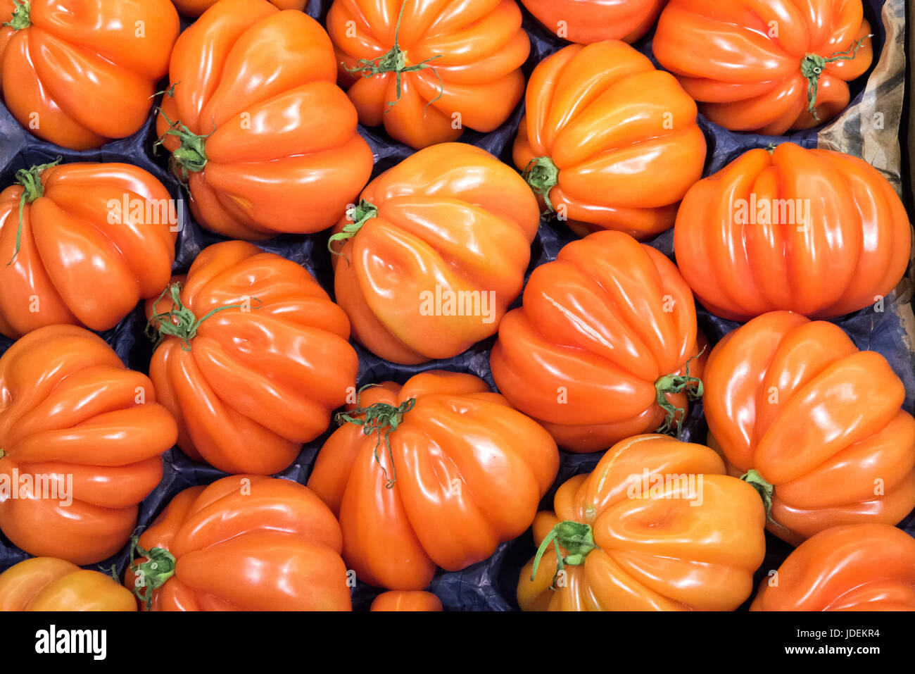 Beefsteak tomatoes for sale at a market Stock Photo