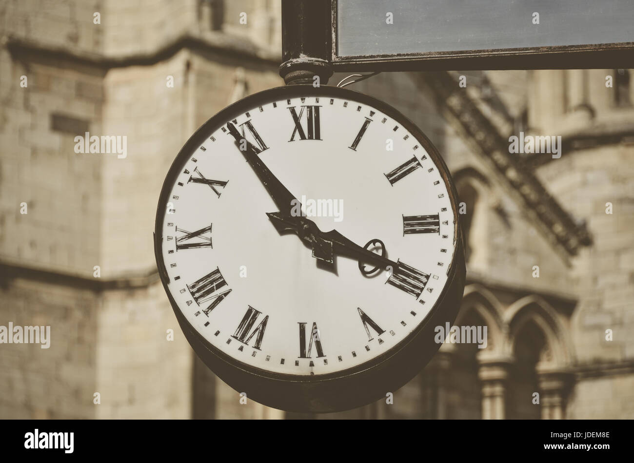 An old vintage clock fixed to wall Stock Photo Alamy