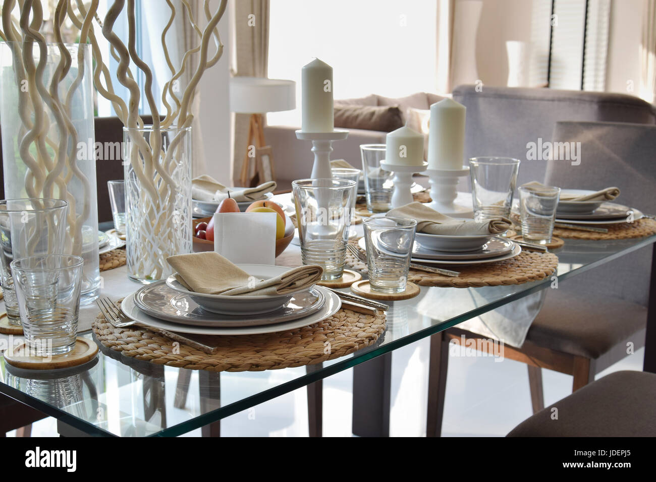 elegant table set in modern style dining room interior Stock Photo - Alamy