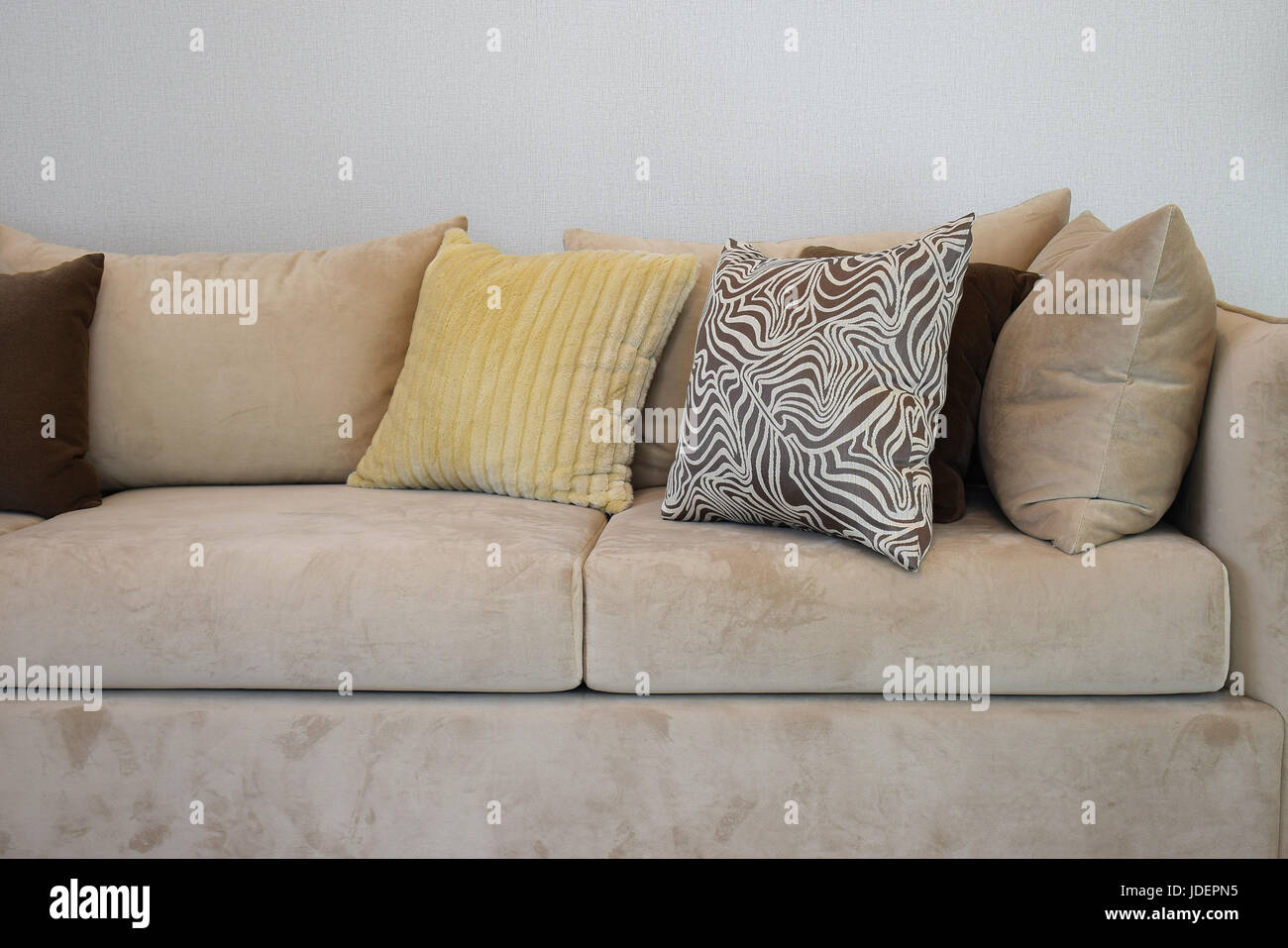 Sy Brown Tweed Sofa With Grey Patterned Pillows Stock