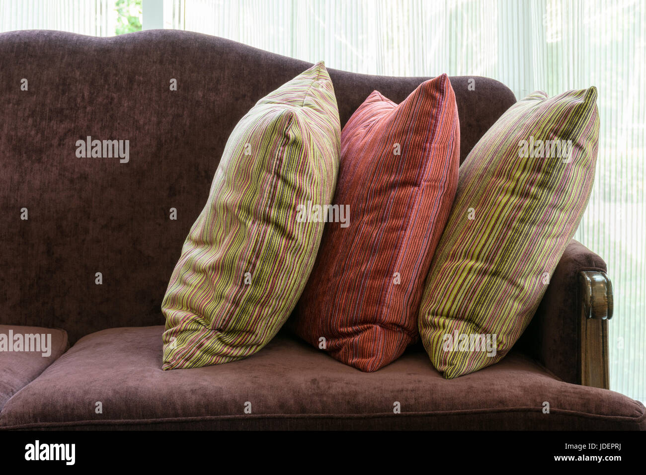 Red Pillows On Red Sofa In Luxury Living Room Interior Stock Photo