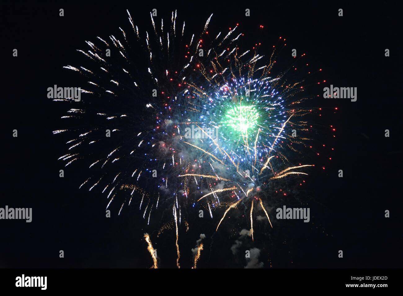 Big colored fireworks in the black night sky Stock Photo