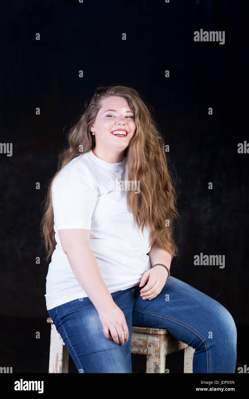 Stunning plus size red head, long beautiful hair, positive energy, sweetheart, big girl, late teen yeas girl, enigmatic, happy and sweet пшкд Stock Photo