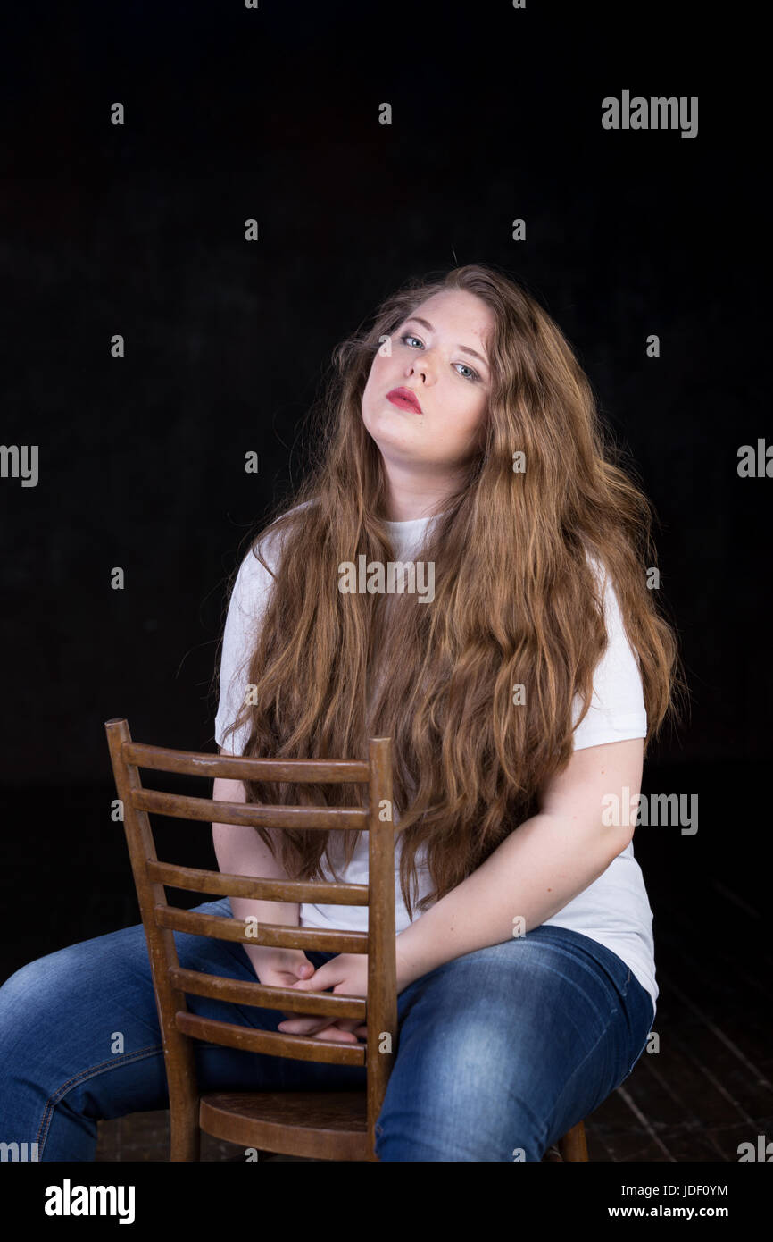 Stunning plus size red head, long beautiful hair, positive energy, sweetheart, big girl, late teen yeas girl, enigmatic, happy and sweet пшкд Stock Photo