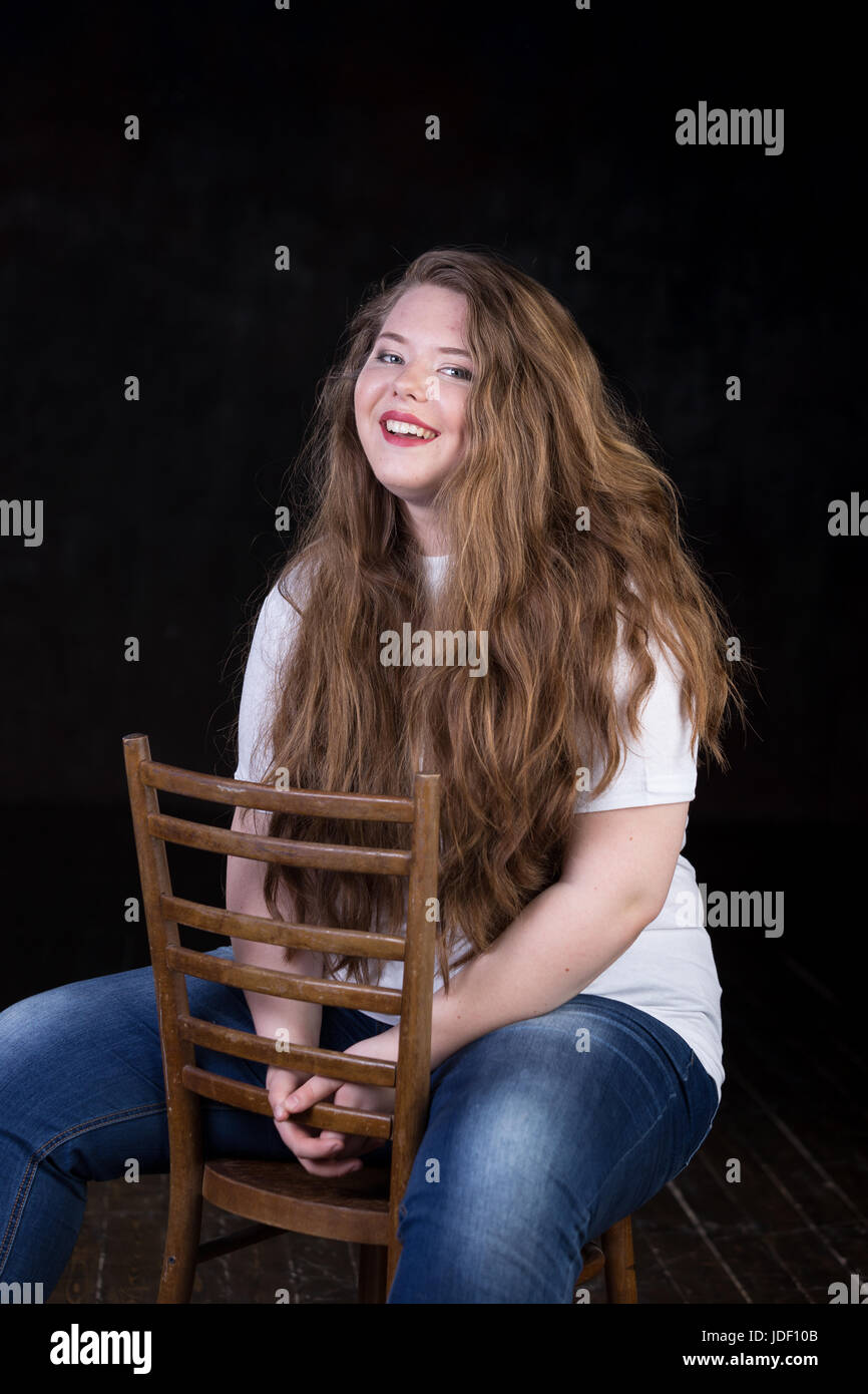 Stunning plus size red head, long beautiful hair, positive energy, sweetheart, big girl, late teen yeas girl, enigmatic, happy and sweet пшкд Stock Photo