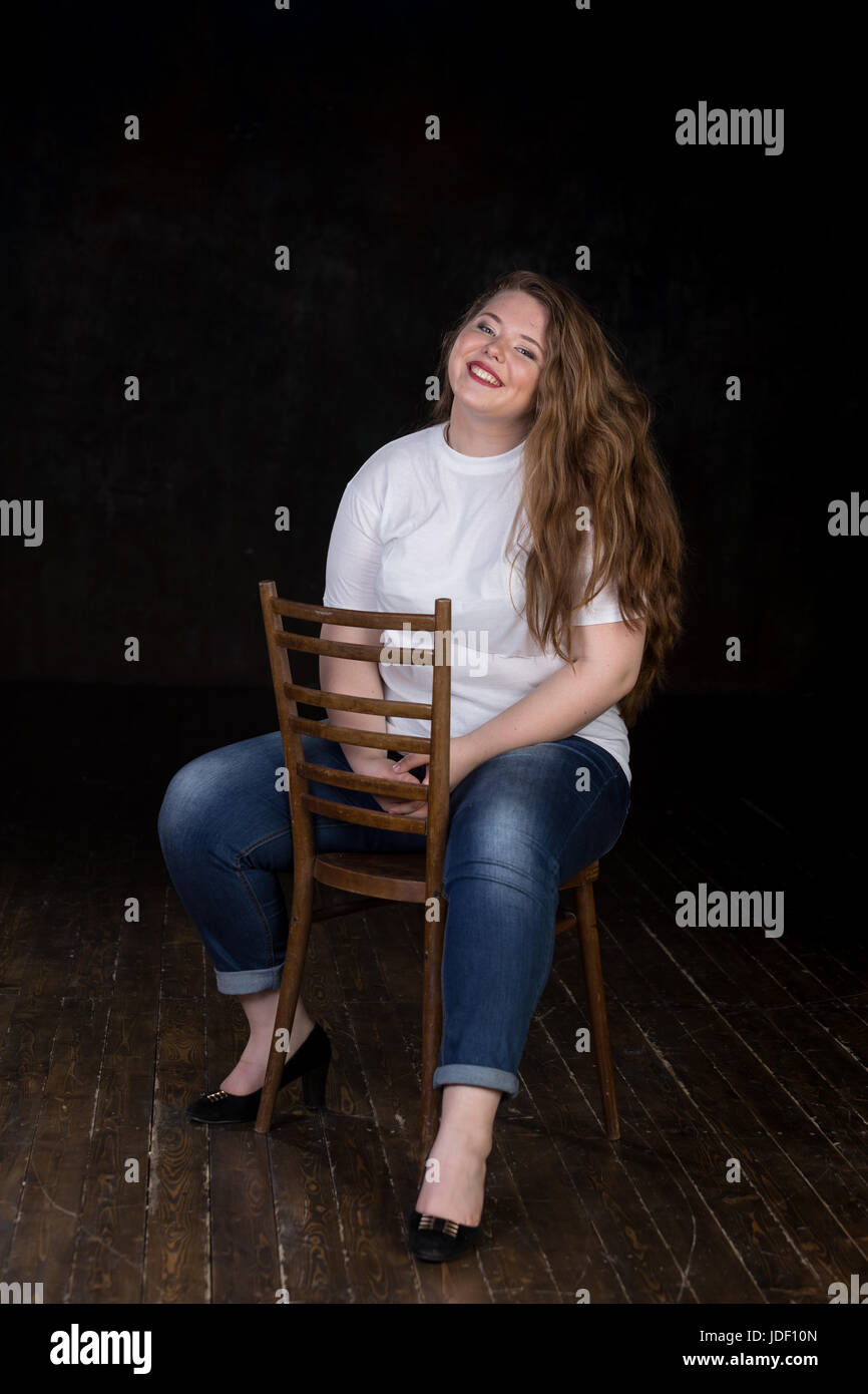 Stunning plus size red head, long beautiful hair, positive energy, sweetheart, big girl, late teen yeas girl, enigmatic, happy and sweet пшкд Stock Photo