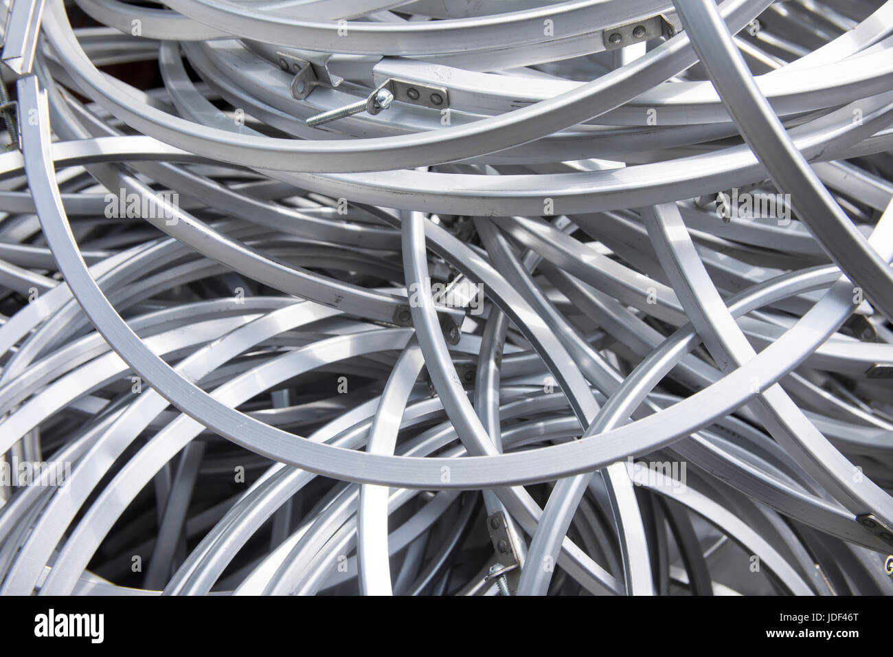 Abstract background of silver metal rims in pile Stock Photo - Alamy