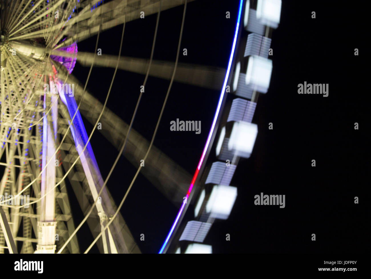 Close up night view of ferris wheel in blurry motion Stock Photo - Alamy
