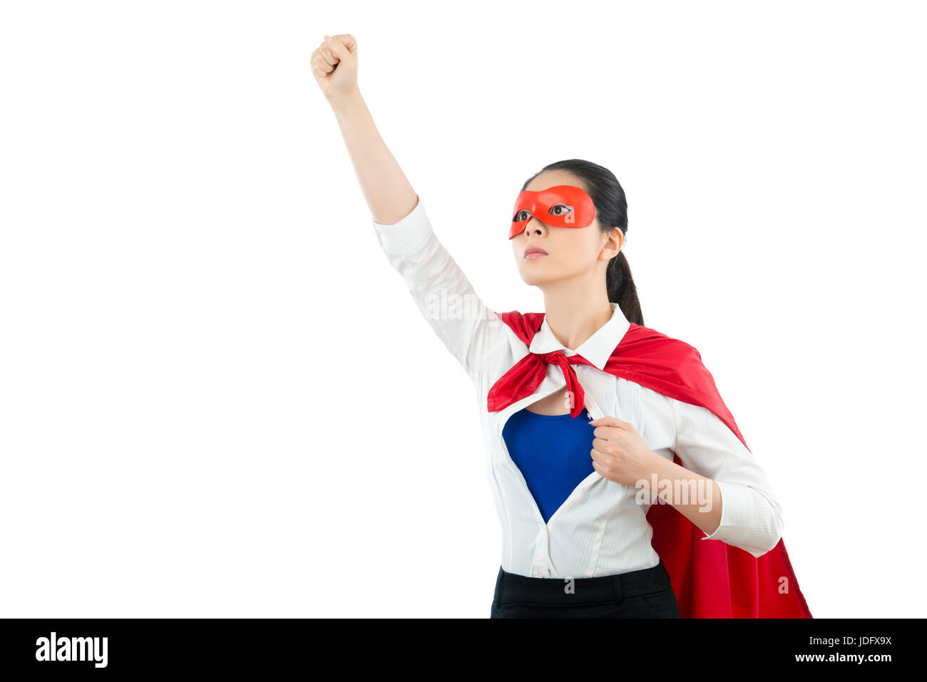 superhero gesturing fistand raise hand above means ready take off to sky with copyspace and opening office shirt showing hero clothing on the blank wh Stock Photo