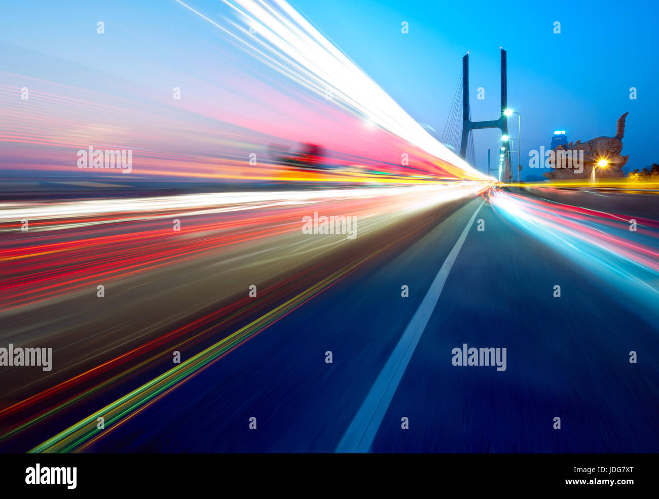 cars light trails on the modern bridge at dusk Stock Photo - Alamy